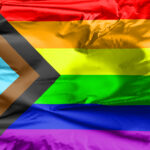LGBT Rainbow Flag with inclusion and progression colors. Symbol of lesbian, gay, bisexual & transgender community. Black and brown stripes to represent marginalised.